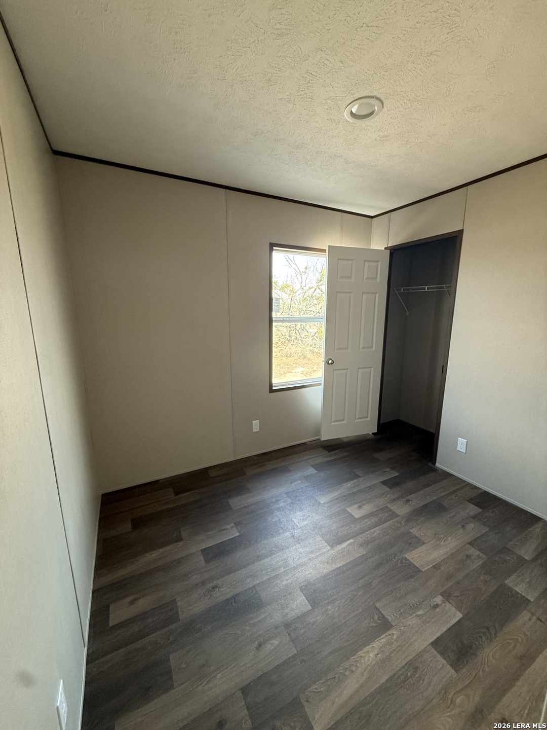 1390 Rendon Road Poteet, TX 78065 - Photo 15 of 22 an empty room with windows