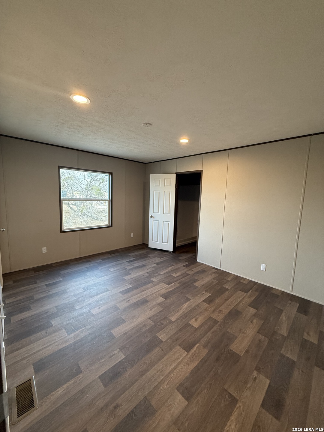 1390 Rendon Road Poteet, TX 78065 - Photo 17 of 22 a view of an empty room with a window