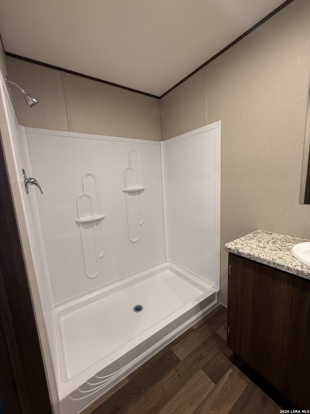 1390 Rendon Road Poteet, TX 78065 - Photo 20 of 22 a bathroom with a tub and shower