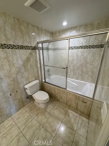 a view of parking garage with cars