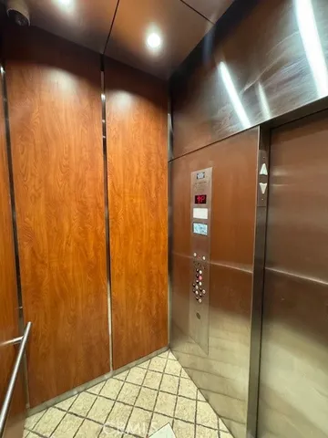 a bathroom with a shower and a glass door