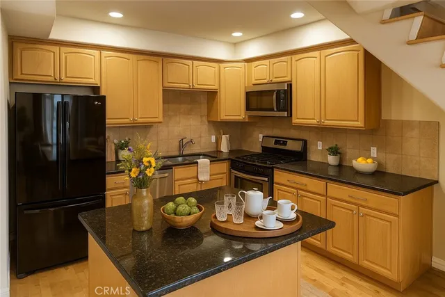 a bathroom with a sink mirror vanity and toilet