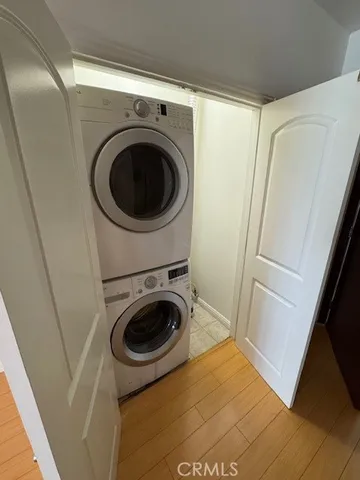 a bedroom with a bed couch and a potted plant