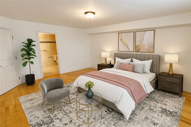 a bedroom with bed and a couch