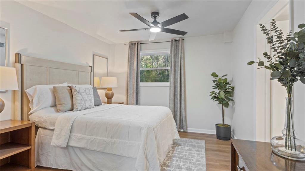 4088 Vale Court Decatur, GA 30035 - Photo 11 of 30 a bedroom with a large bed and a potted plant