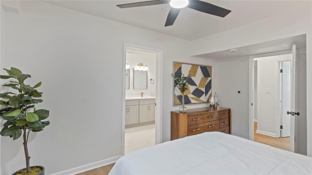 4088 Vale Court Decatur, GA 30035 - Photo 12 of 30 a bedroom with a bed and a potted plant