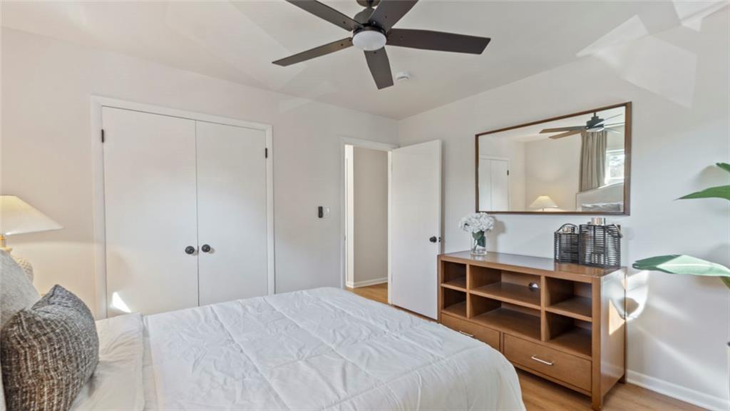 4088 Vale Court Decatur, GA 30035 - Photo 20 of 30 a bedroom with a bed and a chandelier