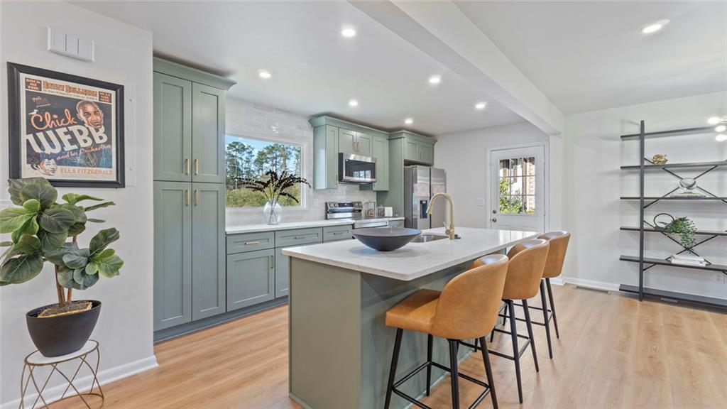 4088 Vale Court Decatur, GA 30035 - Photo 7 of 30 a view of a dining room with furniture and wooden floor