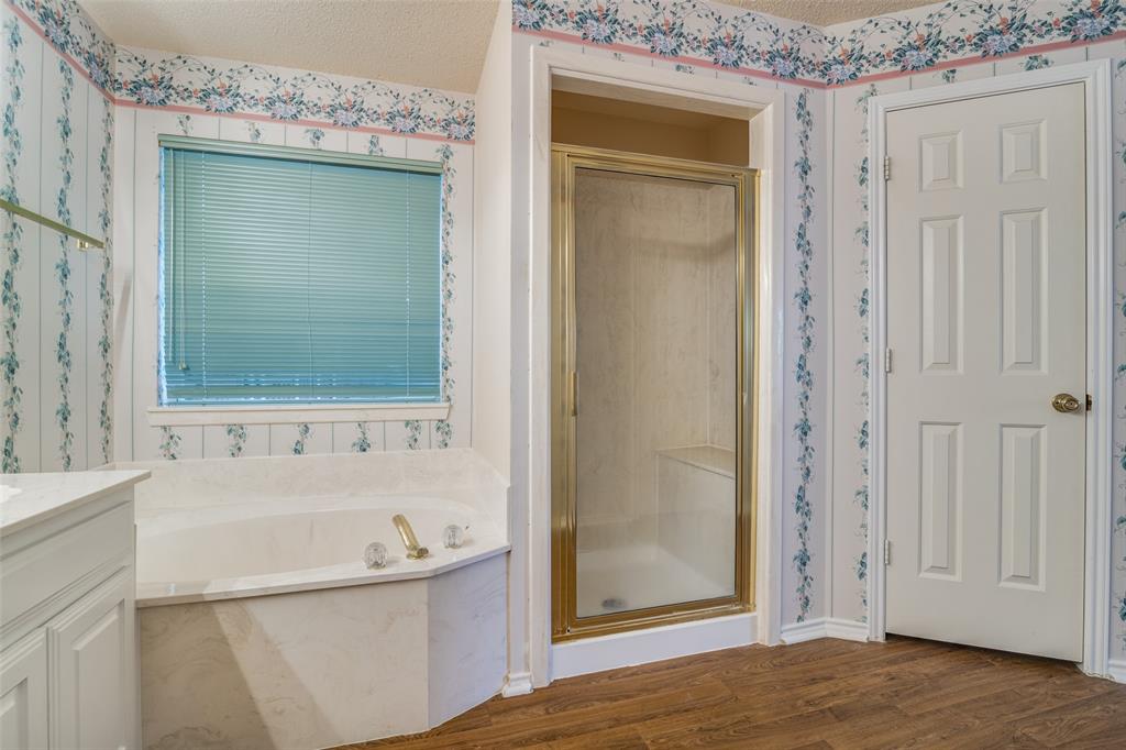1202 Morrow Lane Allen, TX 75002 - Photo 21 of 35 Bathroom with wallpapered walls, a stall shower, vanity, a bath, and dark wood-style flooring
