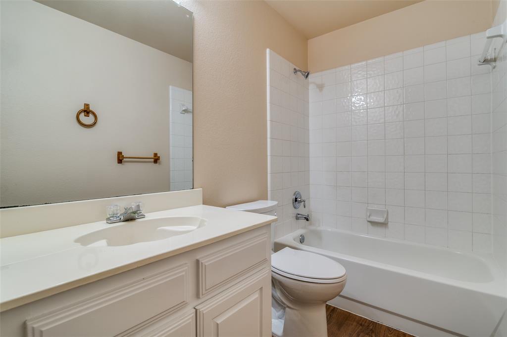 1202 Morrow Lane Allen, TX 75002 - Photo 26 of 35 Full bath featuring vanity, shower / washtub combination, and dark wood-type flooring