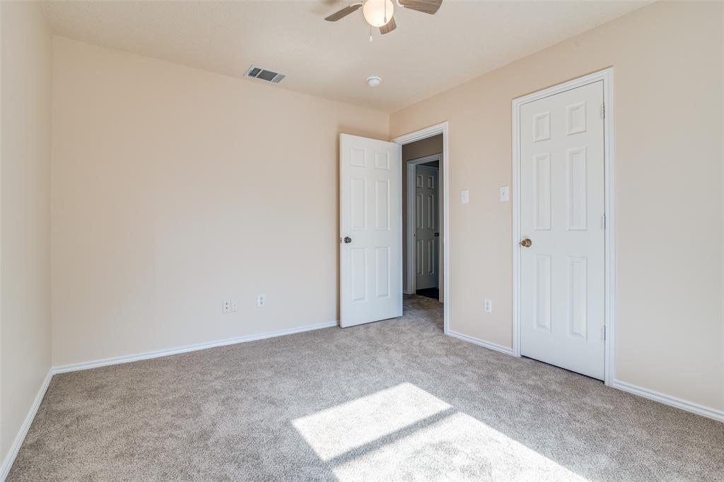 1202 Morrow Lane Allen, TX 75002 - Photo 30 of 35 Unfurnished bedroom featuring light colored carpet and a ceiling fan