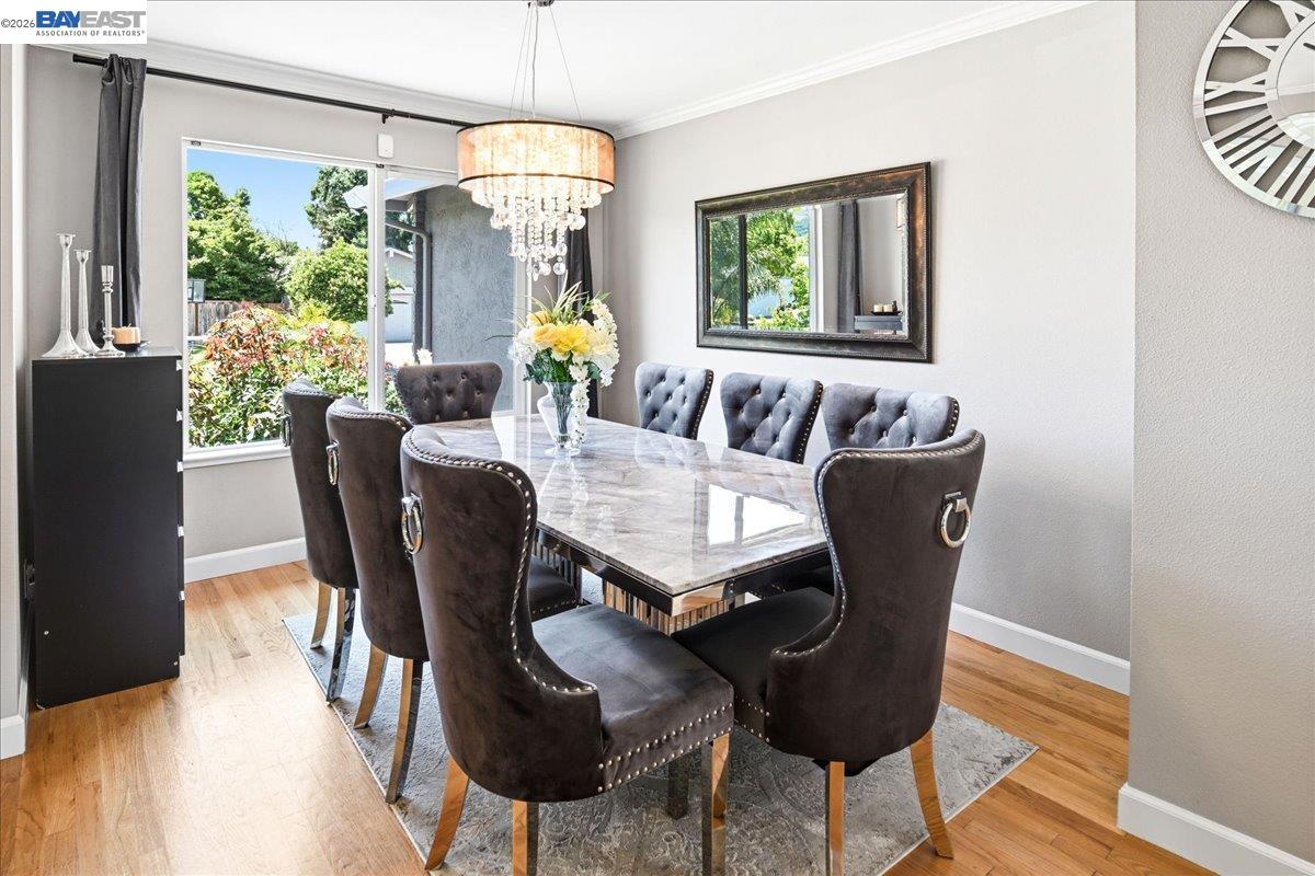 2861 Millbridge Place San Ramon, CA 94583 - Photo 12 of 58 a view of a dining room with furniture a chandelier and wooden floor