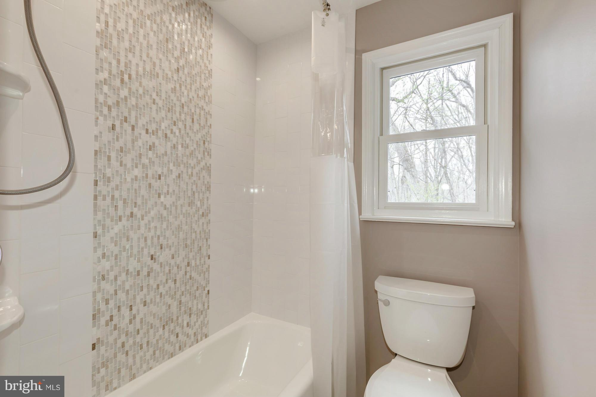 10515 Adel Road Oakton, VA 22124 - Photo 22 of 30 Hall Bath With Custom Tile