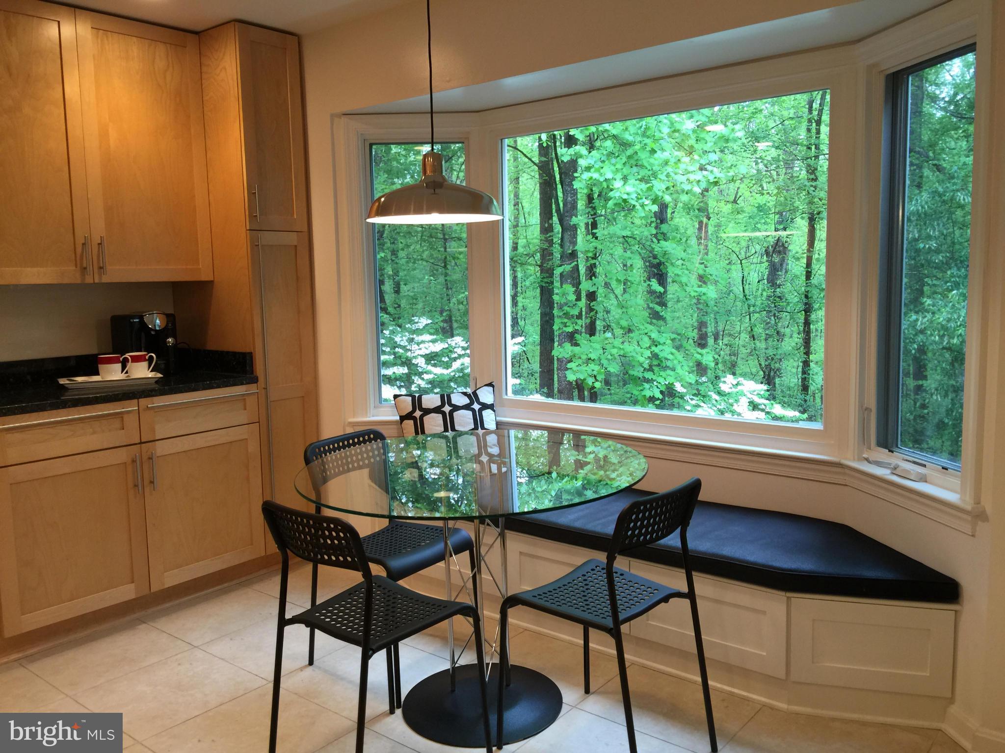Beautiful bay window overlooking wooded yard
