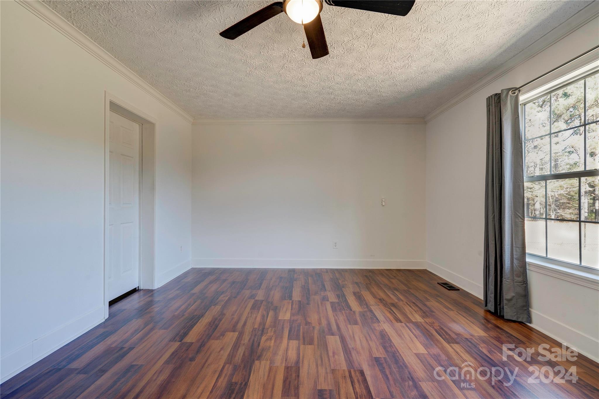 441 Dills Road Rutherfordton, NC 28139 - Photo 20 of 47 an empty room with wooden floor cabinet and windows