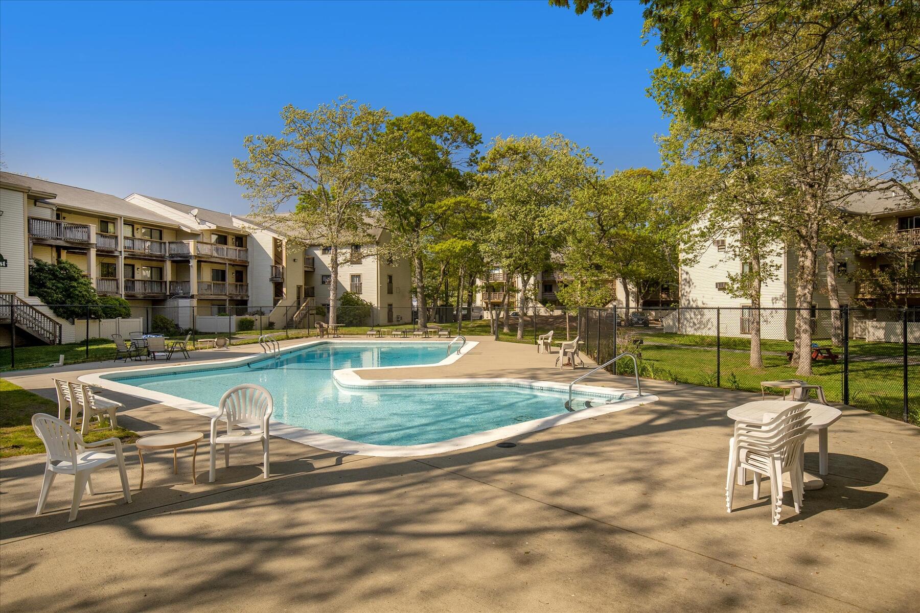 800 Bearses Way, Unit 1EB Hyannis, MA 02601 - Photo 27 of 37 a view of a swimming pool with a patio