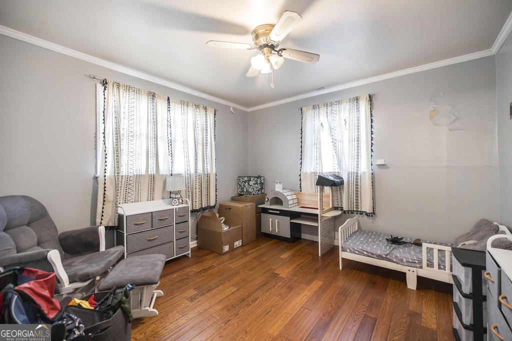 620 Pine Ridge Street Perry, GA 31069 - Photo 13 of 28 a living room with furniture and a wooden floor