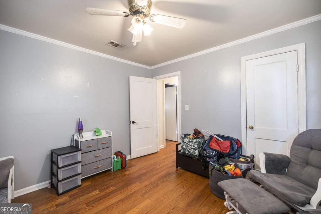 620 Pine Ridge Street Perry, GA 31069 - Photo 14 of 28 a living room with furniture and a wooden floor