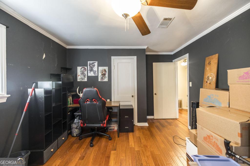 620 Pine Ridge Street Perry, GA 31069 - Photo 17 of 28 a living room with furniture and a flat screen tv