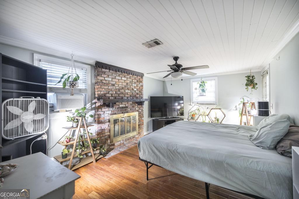 620 Pine Ridge Street Perry, GA 31069 - Photo 18 of 28 a bedroom with furniture and a flat screen tv