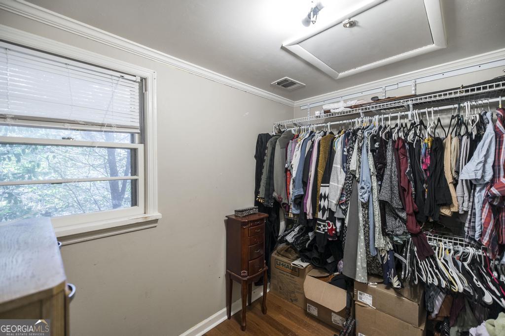 620 Pine Ridge Street Perry, GA 31069 - Photo 20 of 28 a view of walk in closet with clothes