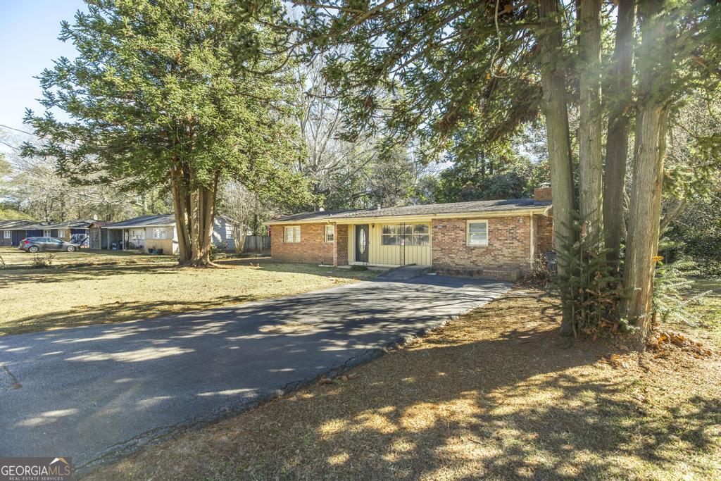 620 Pine Ridge Street Perry, GA 31069 - Photo 2 of 28 a view of a house with a yard