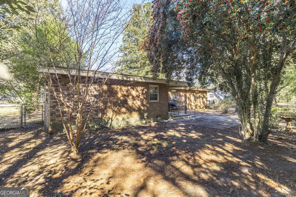620 Pine Ridge Street Perry, GA 31069 - Photo 24 of 28 a view of a yard with large tree