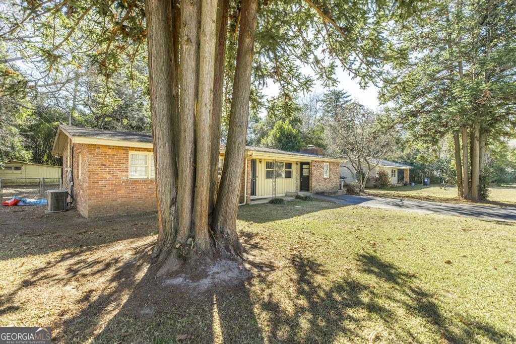 620 Pine Ridge Street Perry, GA 31069 - Photo 4 of 28 a view of a house with backyard and tree