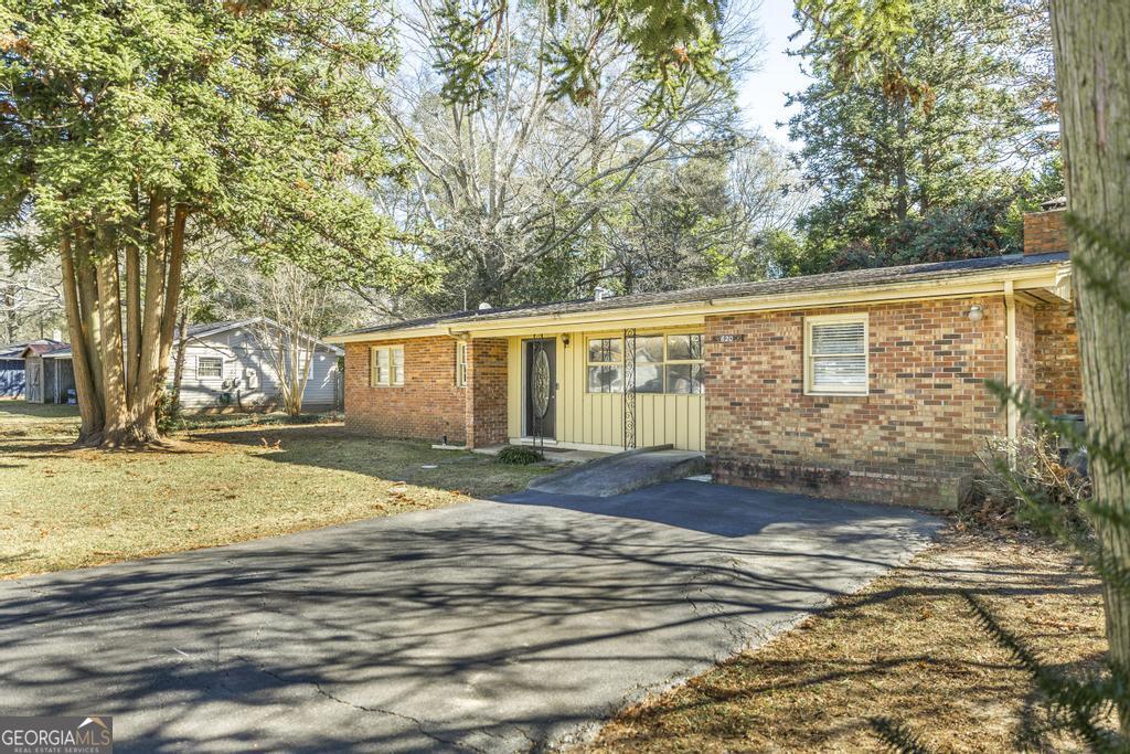 620 Pine Ridge Street Perry, GA 31069 - Photo 5 of 28 a view of a backyard with large trees