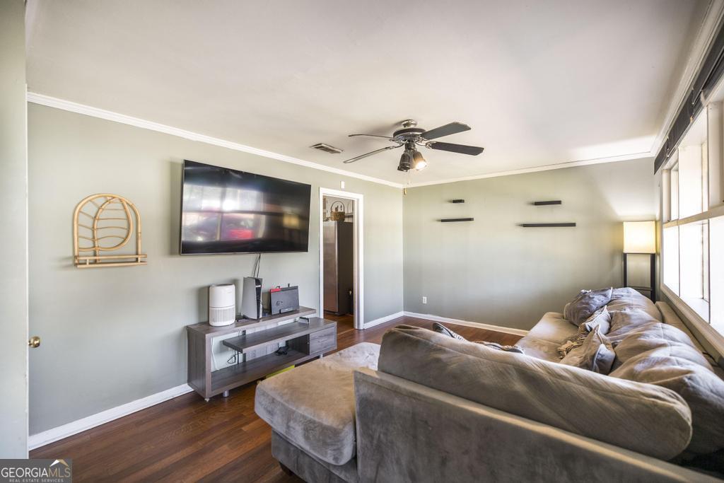 620 Pine Ridge Street Perry, GA 31069 - Photo 8 of 28 a living room with furniture and a flat screen tv