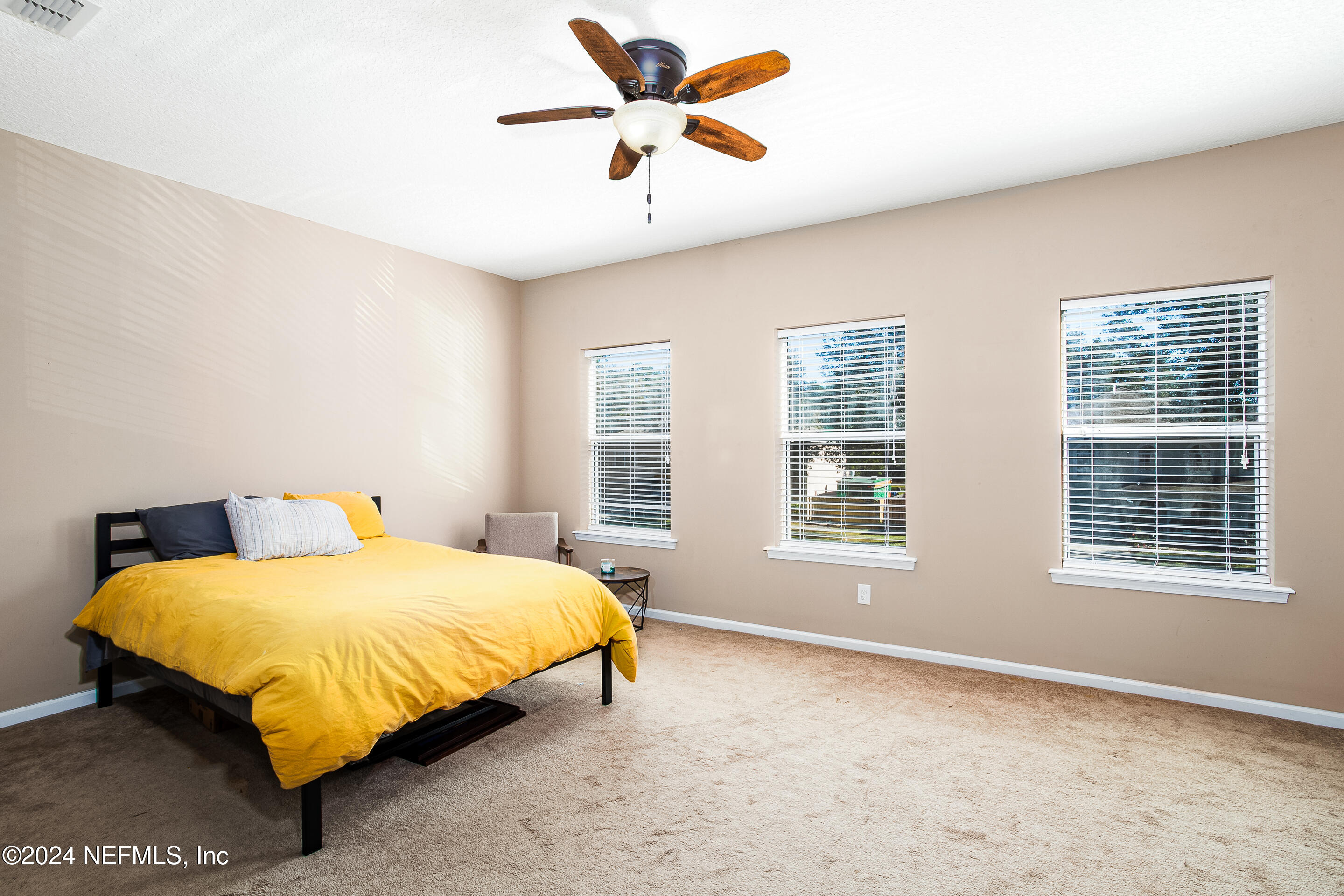 87241 Lents Road Yulee, FL 32097 - Photo 15 of 19 a bedroom with a bed and window