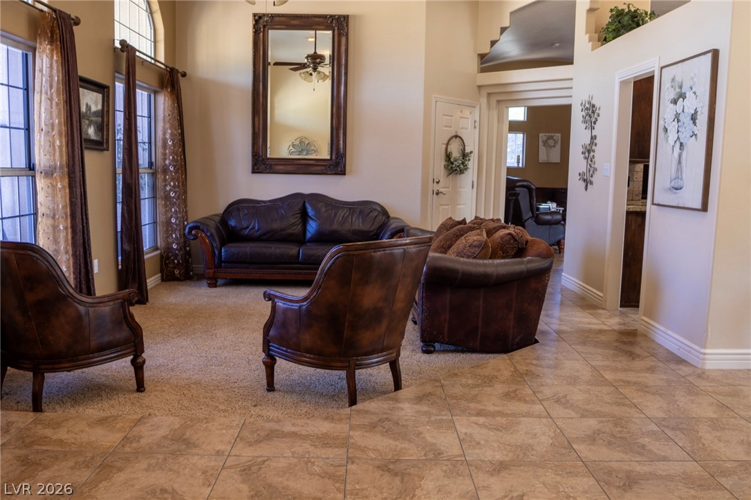 2775 Taylor Street Logandale, NV 89021 - Photo 12 of 41 This living room provides a warm and inviting atmosphere, perfect for relaxation or entertaining.