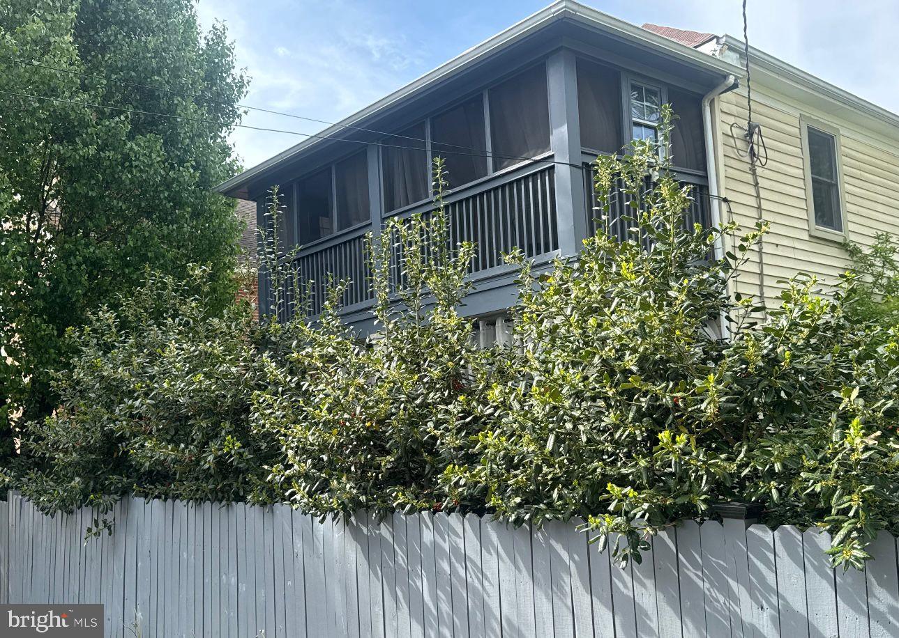 a view of a house with a flower garden