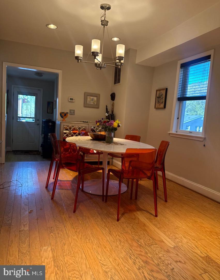 4818 Sheriff Road Northeast Washington, DC 20019 - Photo 11 of 36 a view of a dining room with furniture and wooden floor