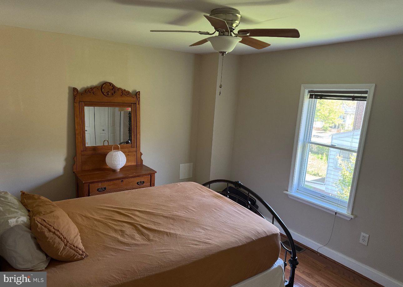 4818 Sheriff Road Northeast Washington, DC 20019 - Photo 18 of 36 a bedroom with a bed and a window