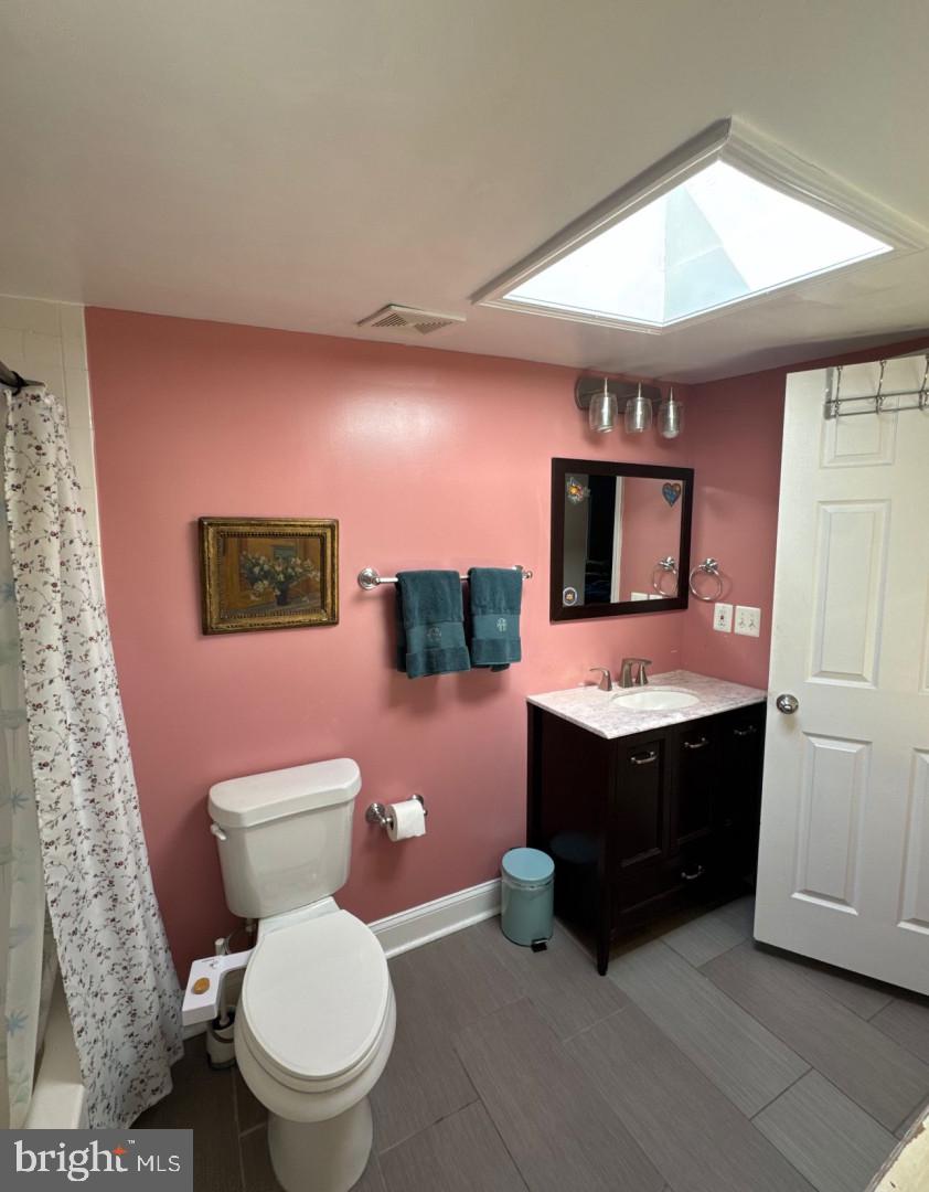 4818 Sheriff Road Northeast Washington, DC 20019 - Photo 23 of 36 a bathroom with a toilet sink and mirror