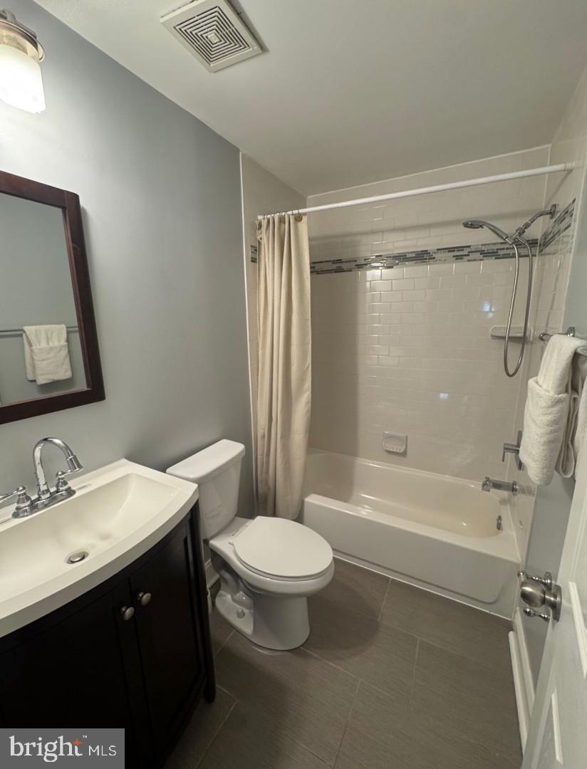 4818 Sheriff Road Northeast Washington, DC 20019 - Photo 26 of 36 a bathroom with a sink a toilet a mirror and a shower