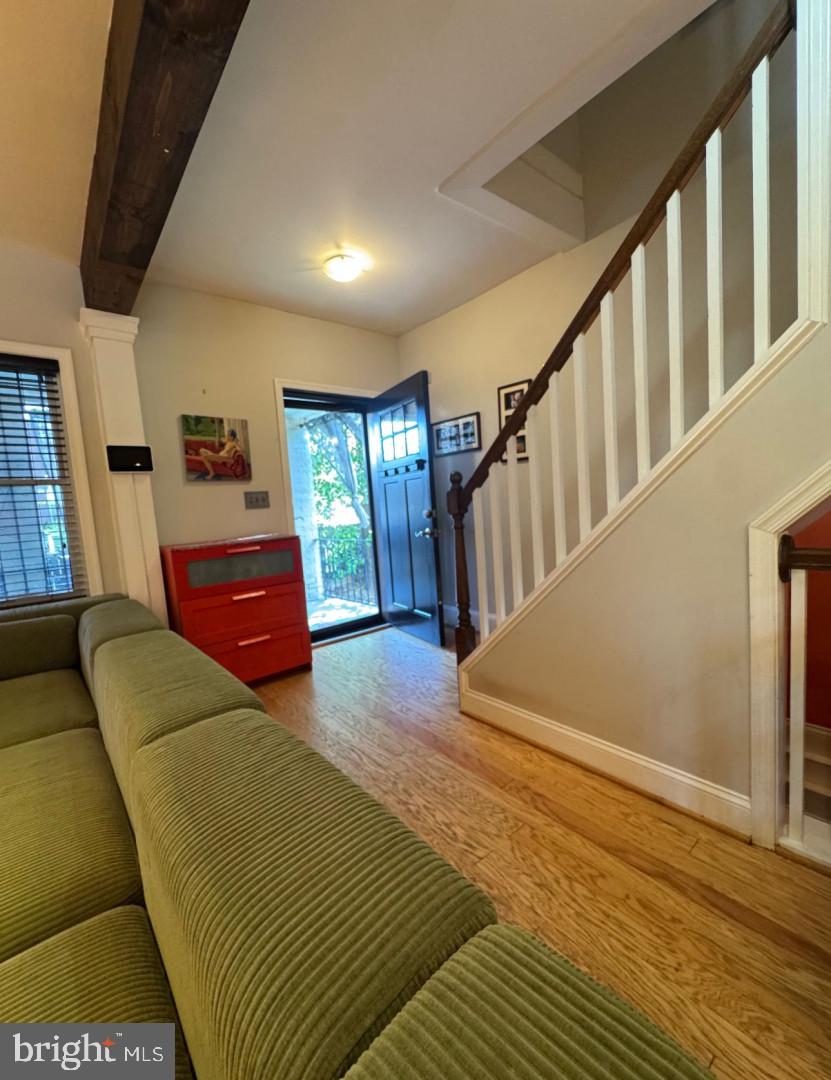 4818 Sheriff Road Northeast Washington, DC 20019 - Photo 4 of 36 a bedroom with furniture and a wooden floor