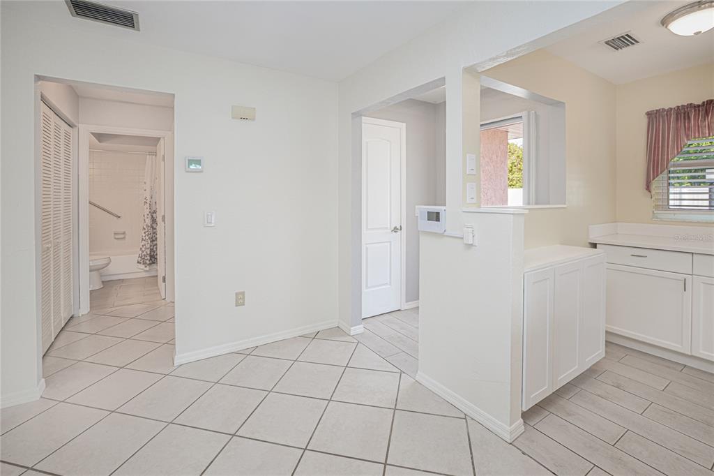 24540 Harbor View Road, Unit D3 Punta Gorda, FL 33980 - Photo 6 of 33 a view of a kitchen with white cabinets