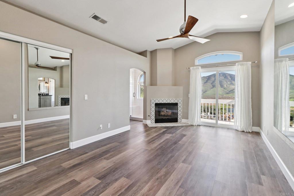 9863 Avenida Colino Spring Valley, CA 91977 - Photo 17 of 54 a view of an empty room with wooden floor and a window
