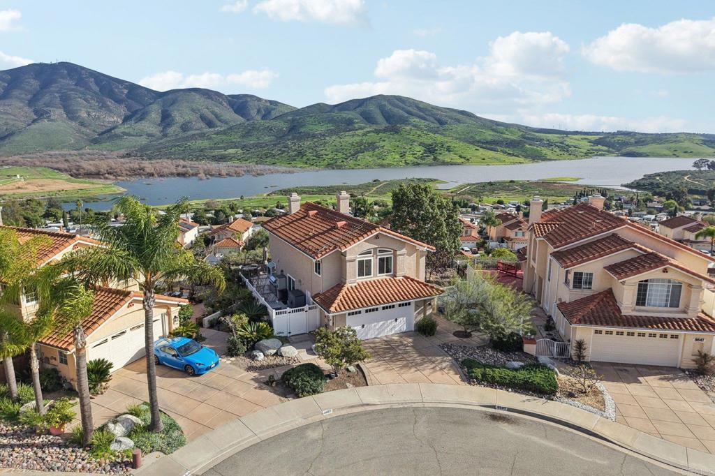 9863 Avenida Colino Spring Valley, CA 91977 - Photo 2 of 54 an aerial view of a house with garden space and mountain view in back