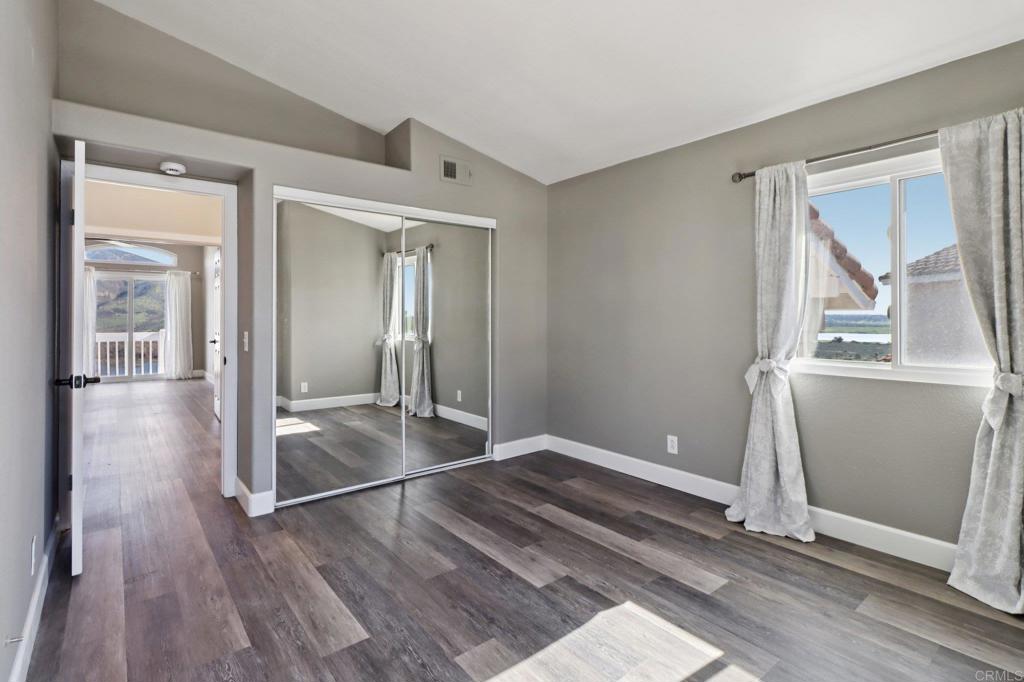 9863 Avenida Colino Spring Valley, CA 91977 - Photo 24 of 54 a view of a room with wooden floor and a bathroom
