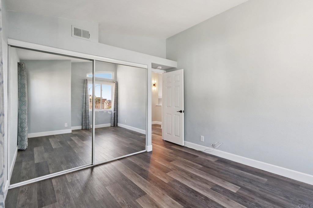 9863 Avenida Colino Spring Valley, CA 91977 - Photo 28 of 54 an empty room with wooden floor