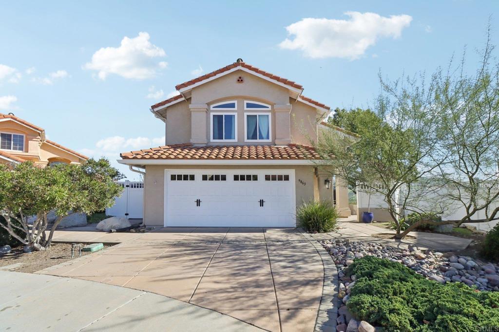 9863 Avenida Colino Spring Valley, CA 91977 - Photo 3 of 54 a front view of a house with a yard