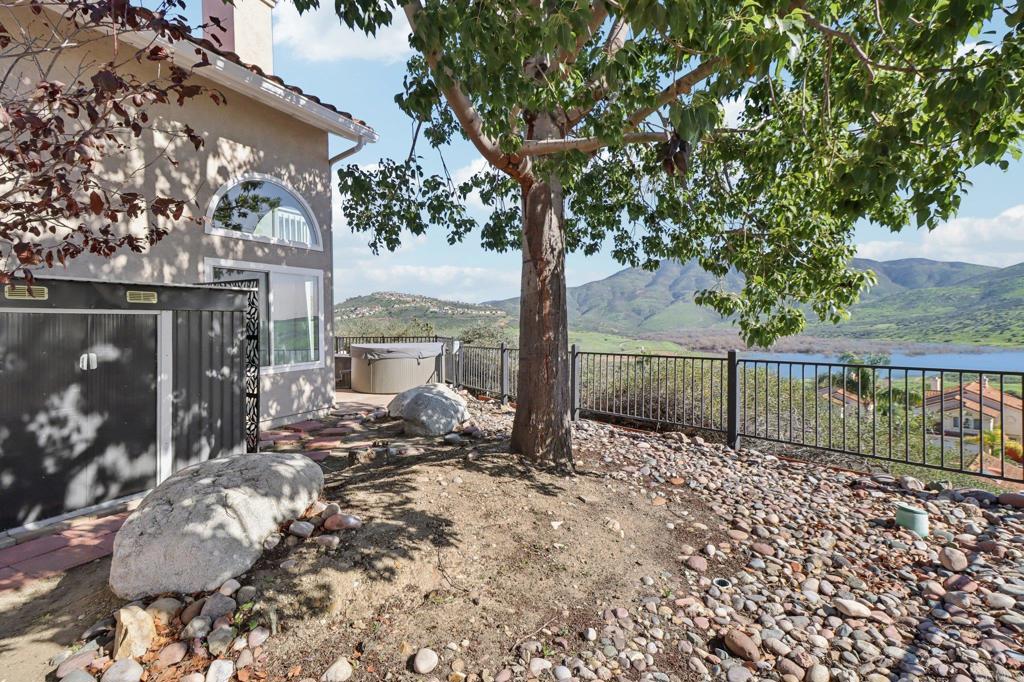 9863 Avenida Colino Spring Valley, CA 91977 - Photo 41 of 54 a bench is sitting in front of a building