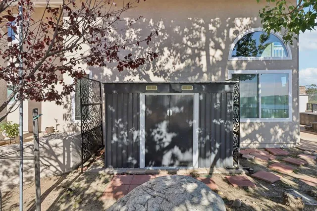 a view of a house with a tree