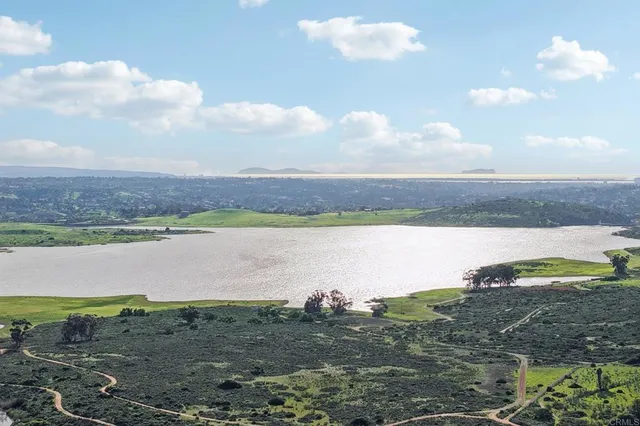 a view of a swimming pool with a yard