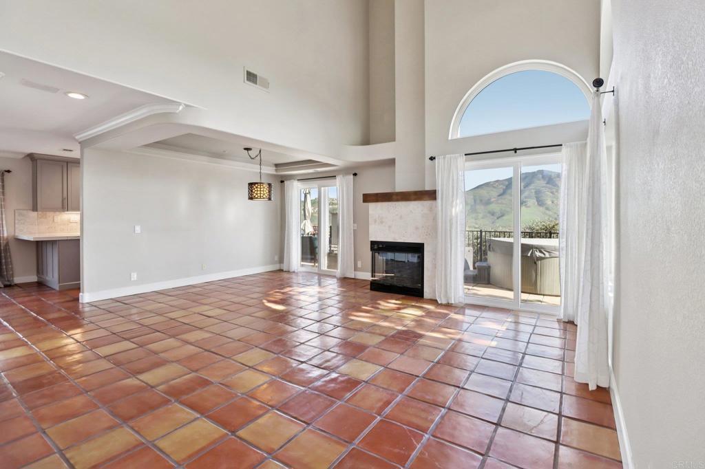 9863 Avenida Colino Spring Valley, CA 91977 - Photo 6 of 54 a view of empty room with wooden floor and fireplace