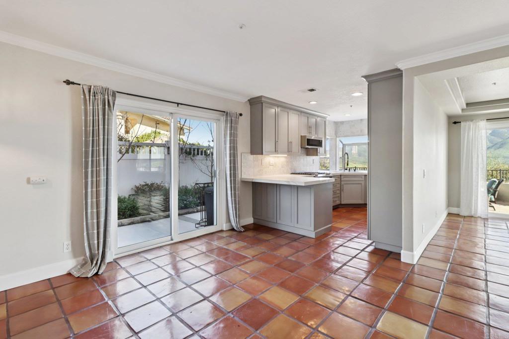 9863 Avenida Colino Spring Valley, CA 91977 - Photo 7 of 54 a open kitchen with stainless steel appliances granite countertop a refrigerator and a sink