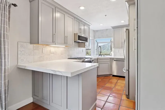 a view of a room with a large window